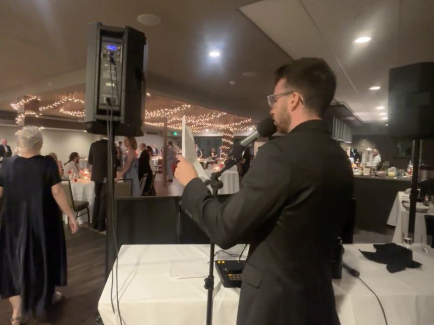 Wedding emcee making an announcement at a New Jersey reception